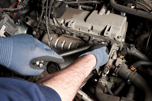 Mechanical repairs a car in the garage. Mechanical repairs a car in the garage.